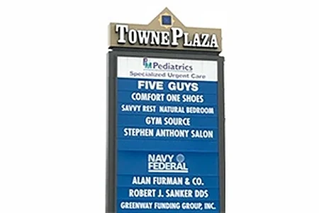 The Towne Plaza sign on Rockville Pike, listing Robert J. Sanker DDS among the tenants.