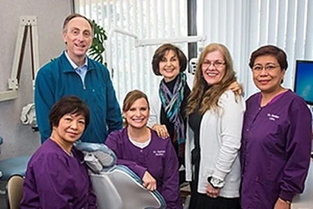 Dr. Sanker and members of the practice team in a treatment room.